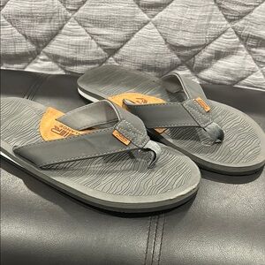 Gray and leather Flip Flops